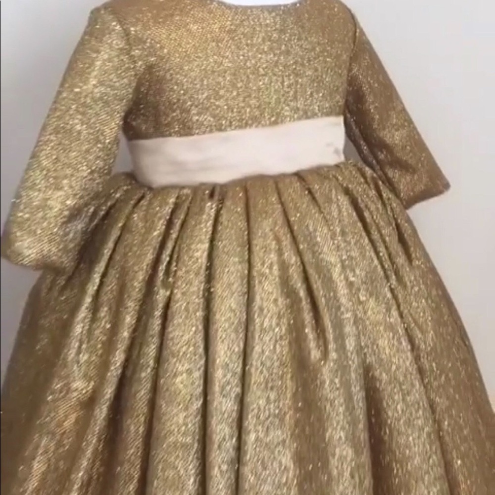Gold dress with pink bow